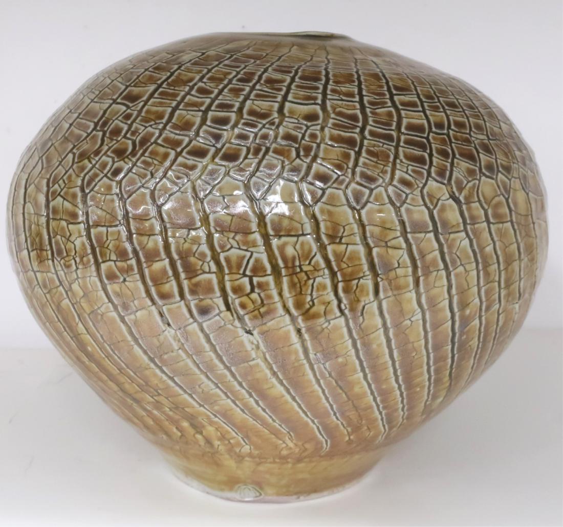 Asian Art Pottery Lizard Skin Design Vase/Vessel: Bulbous form. Possibly Korean(?) Darker browns, ochre colors; incised line patterning; smooth glaze on a white ceramic. Distinct mountain or beehive shaped incised mark. Signed on bottom. 9.5"H x 11D 