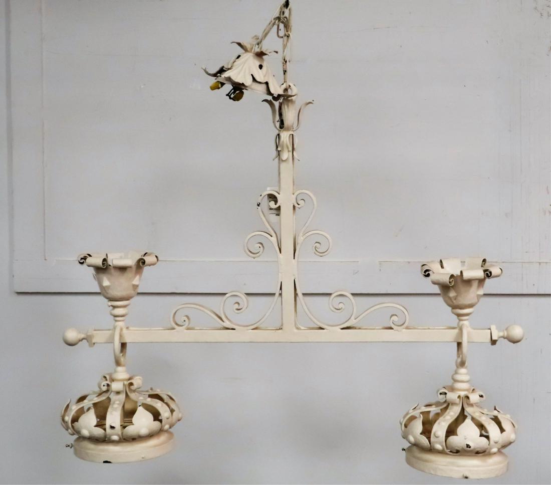 Ornate Metal Kitchen Island or Pool Table Light: Appears to be bronze, brass, or other metal under heavy coat of white paint. T form structure w/ scrolled support brackets.Two fixed "crown" shaped fixtures w/ up facing petal forms above each. Leaf f