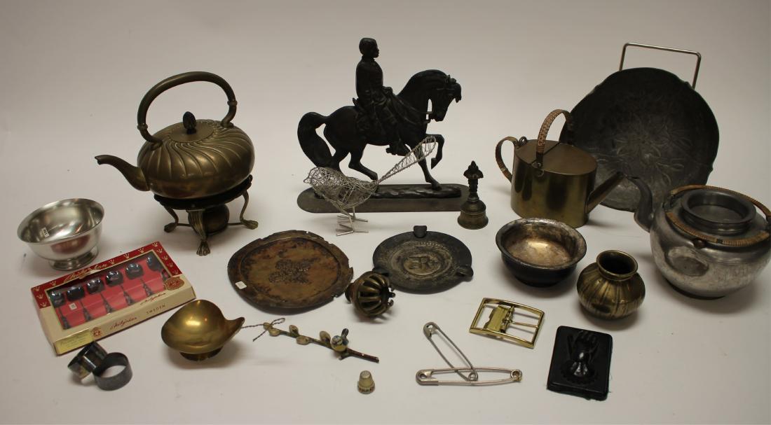 Group of Mostly Southeast Asian Metal Objects: Group of Mostly Southeast Asian Metal Objects includes pressed and etched metalwork, teapots, soldier on horseback doorstop, box of silverplate spoons, contemporary wire bird sculpture along with pain