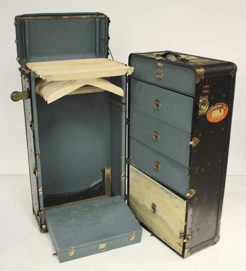 Vintage OshKosh Metal Steamer Wardrobe Trunk: Vintage OshKosh Metal Steamer Wardrobe Trunk with many Cunard White Star Labels affixed, fabric lined interior fitted with many storage compartments 42"x 23 " x 23" MORT6174 MM