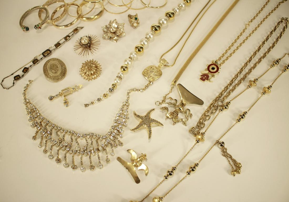 Gold Tone Costume Jewelry: Clip earrings (Ciner), Liberty of London earrings, pins, pierced earrings, necklaces, faceted beaded bracelet with sterling clasp and rhinestones. Some signed. Various. SAP1314/LOT KR