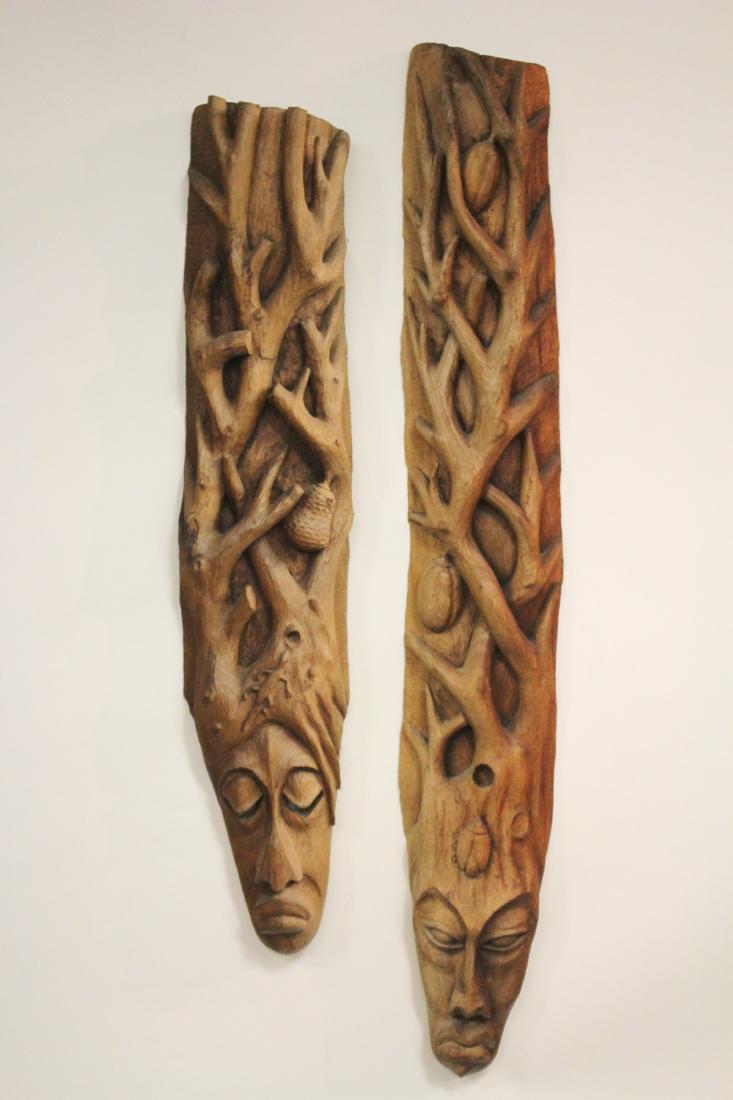 2 Haitian Carvings, signed Roger Francois: 2 Haitian Carvings, signed Roger Francois. Masks with tree branch and fruit. 52 h by 8 w and 44 h by 8 w HCAP5549/2 wt