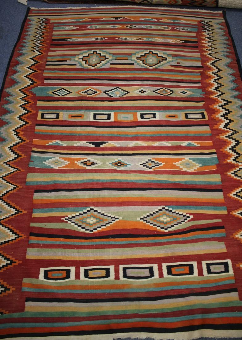 Kilim Rug. Southwest Colors 6' x 9': 6' by 9'-2" Property from the estate of Philip Roth. Philip Roth was born in Newark New Jersey on 19 March, 1933. The second child of second-generation Americans Bess and Herman Roth, Roth grew up in 