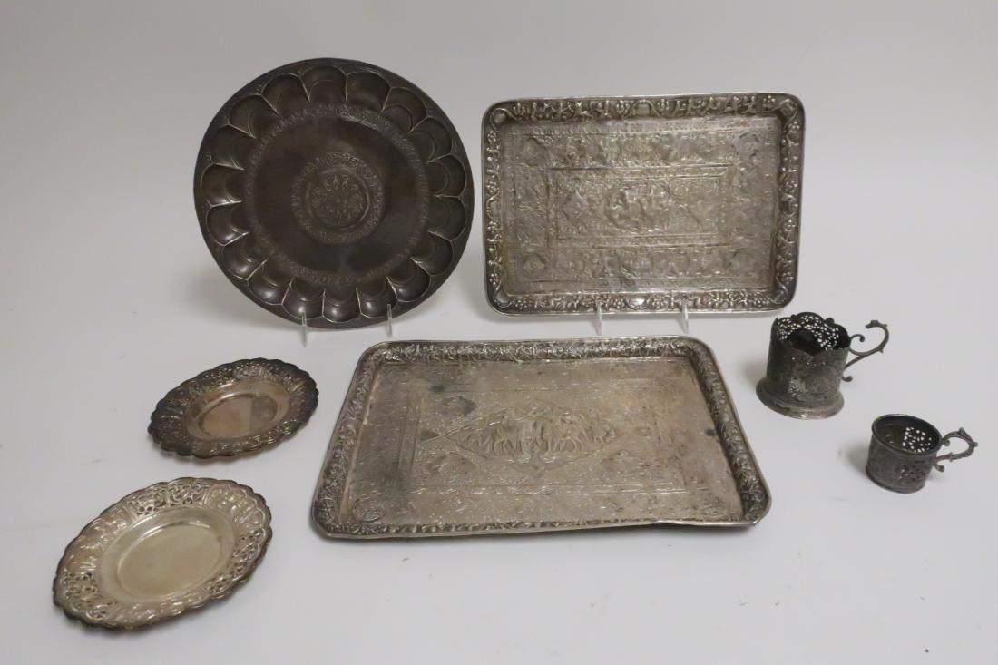 Islamic Metal/Silver: Trays Dishes Cups: the rectangular trays and small dishes heavily chased with warriors and beasts, the large round tray with primitive punched marks, the cup holders and the others unmarked the round tray 11.5" diameter