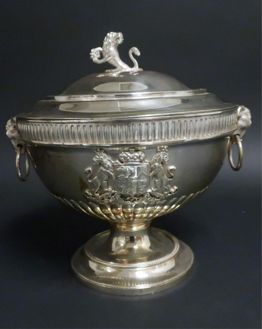 George III Silver Two-Handled Covered Bowl: Maker's mark I. R. in rectangle, London, 1780. The inner liner marked London WH 1981. The bowl with ribbed lower section and fluted rim mounted with two ram's head and loose ring handles and with a ro
