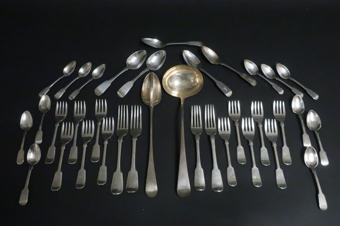 Group of Georgian, Victorian, & Irish Flatware: 18th and 19th century. Fiddle & Old English pattern comprises: 2 serving pieces, 12 salad forks, 4 dinner forks, 12 coffee spoons, 5 dessert/soup spoons. Various dates and makers. 50 ozt. Servers: 12"