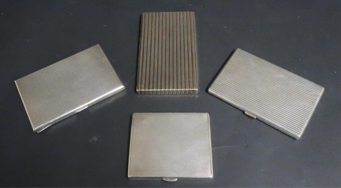 4 Silver Cigarette Boxes Dunhill Boucheron Spain: 4 Silver Cigarette Boxes. Comprises; Dunhill w/ French silver marks, Boucheron silver & silver gilt w/ French marks. Argentina .925 mark and Spain .915 mark and gilt interior. 21.4 ozt Boucheron (larg