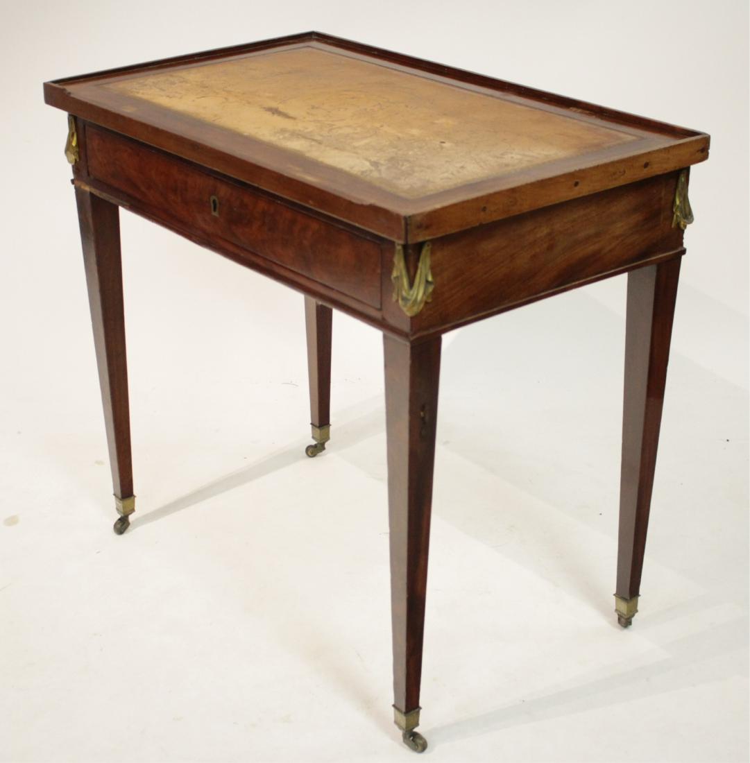 Napoleon III Mahogany Writing/Games Desk: Napoleon III Mahogany and Ormolu Writing Desk and Games Table, 19th C., later reversible top with tooled greek key motif leather and felted insets, recessed glass fitted top, on casters 29"H x 31 1/2"