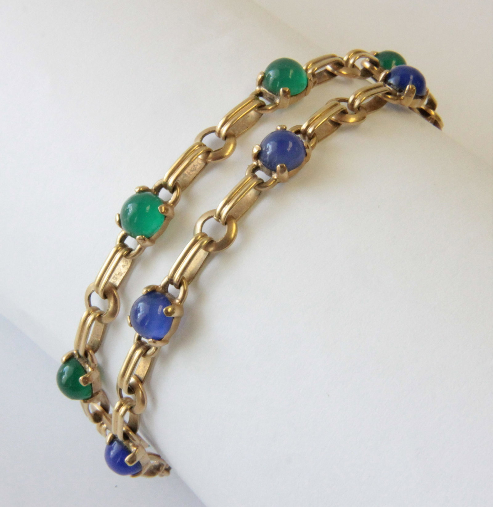 14K Chrysoprase and Blue Chalcedony Bracelets: 7 Round cabochon blue chalcedony each measure approximately 6mm diameter, 7 Round cabochon chrysoprase each measure approximately 6mm diameter. Each 7" long. Gross weight of 16.8 grams. Property from