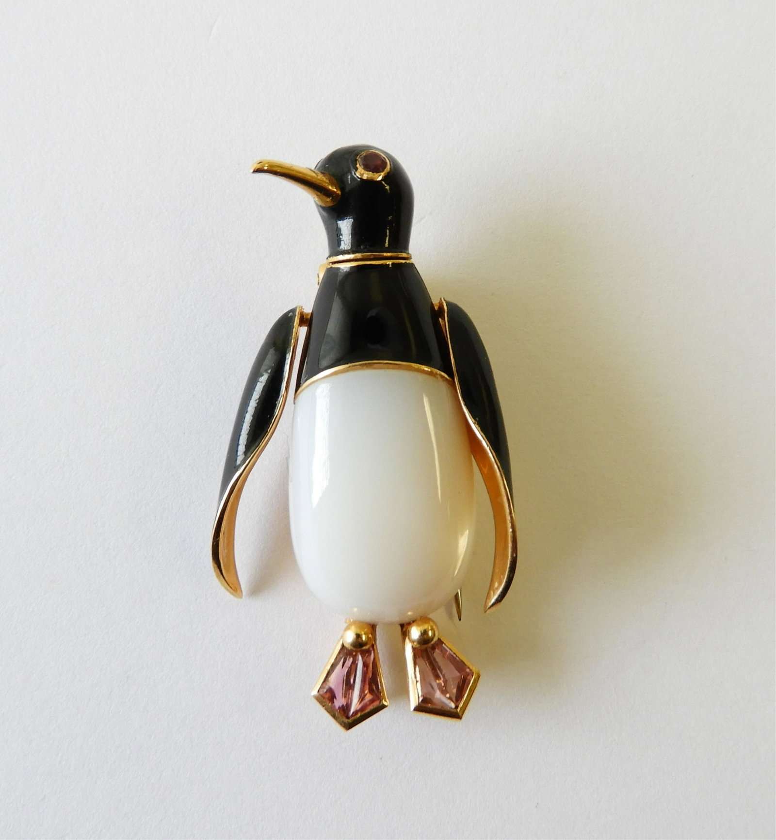 Agate & Black Enamel Penguin Brooch: This 1.5" tall penguin brooch features a white agate body, black enamel upper body/wings, pink tourmaline feet, and ruby eyes all set in 18k yellow gold. Back of body engraved "J. Parmentier Paris BTE