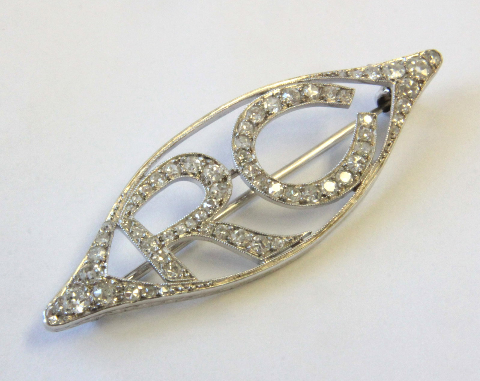 Platinum & Diamond RC Brooch: Initials in single cut diamonds of varying sizes. 1.75" wide. Gross weight of 4.3 grams. Property from the estate of Rosalie Coe Weir