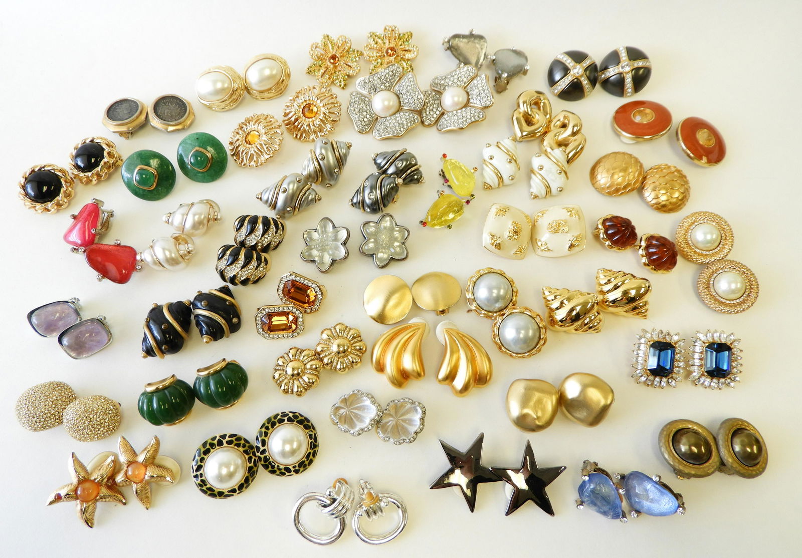 40+ Pairs of Designer Costume Earrings: Designers include Valentino, Escada, Christian Dior, Kenneth J Lane, Carol Lee, Ciner, Replica, Cecile Jeanne, Erwin Pearl, plus more. All clip ons. Largest pair is 2" square. Property from the estate