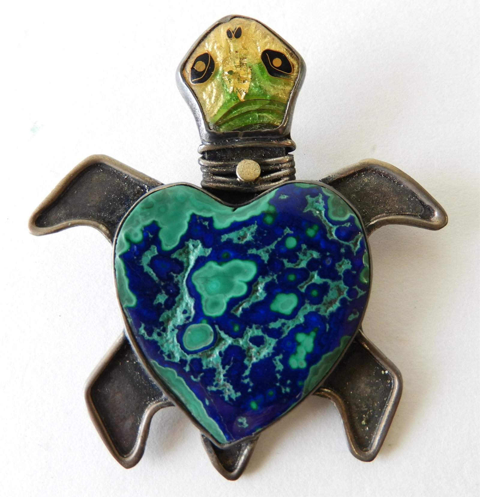 Sea Turtle Brooch: Adorable sterling silver sea turtle brooch/pendant with cloisonne enamel face and hard stone body with 22k and 24k gold detail elements by Kristin Holeman. Signed and marked on back. 2" x 2" Property 