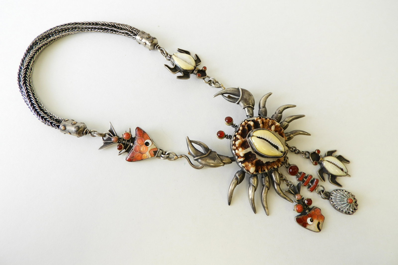 Impressive Puka Shell Crab Necklace: Large sterling silver crab pendant with coral and shell body & hardstone eyes. Two shell sea turtles, two cloisonne enamel fish, and another shell drop. Necklace with 22k and 24k gold detail elements.