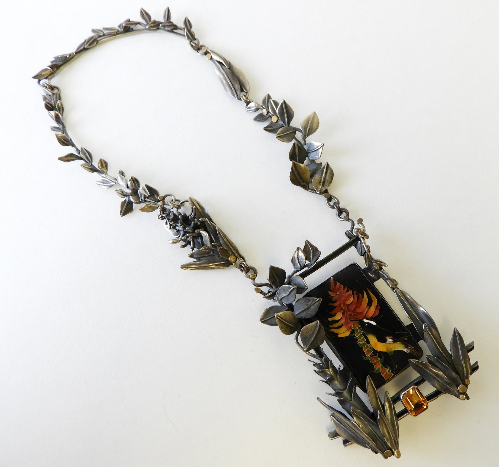 Enamel Bananaquit Necklace: Sterling silver and 24k gold necklace with cloisonne enamel banaquit pendant. Citrine detail on bottom. Signed Kristin Holeman, 2008. Property from the estate of Rosalie Coe Weir