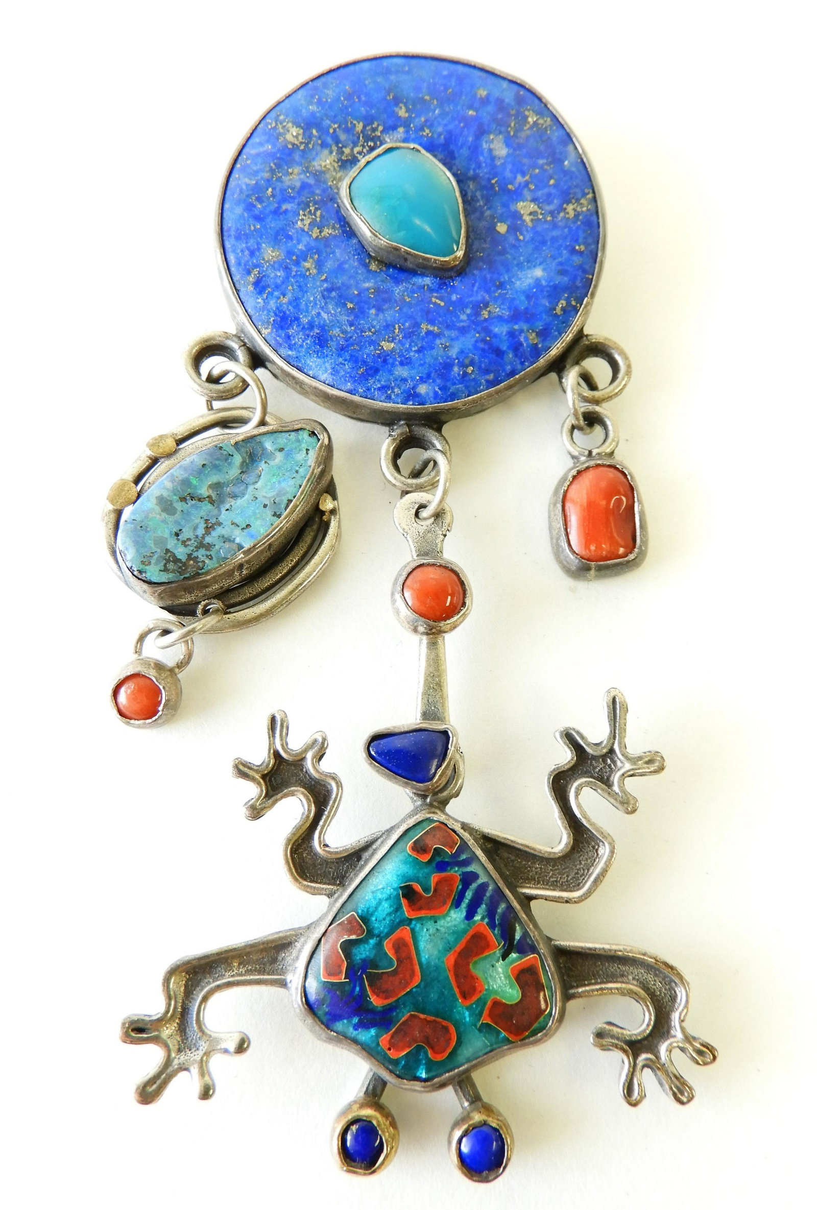 Turquoise & Sterling Tree Frog Brooch: Sterling silver with 22k gold detail element brooch. Large central turquoise and other hardstone accents. Cloisonne enamel frog. Signed Kristin Holeman.4" long Property from the estate of Rosalie Coe 