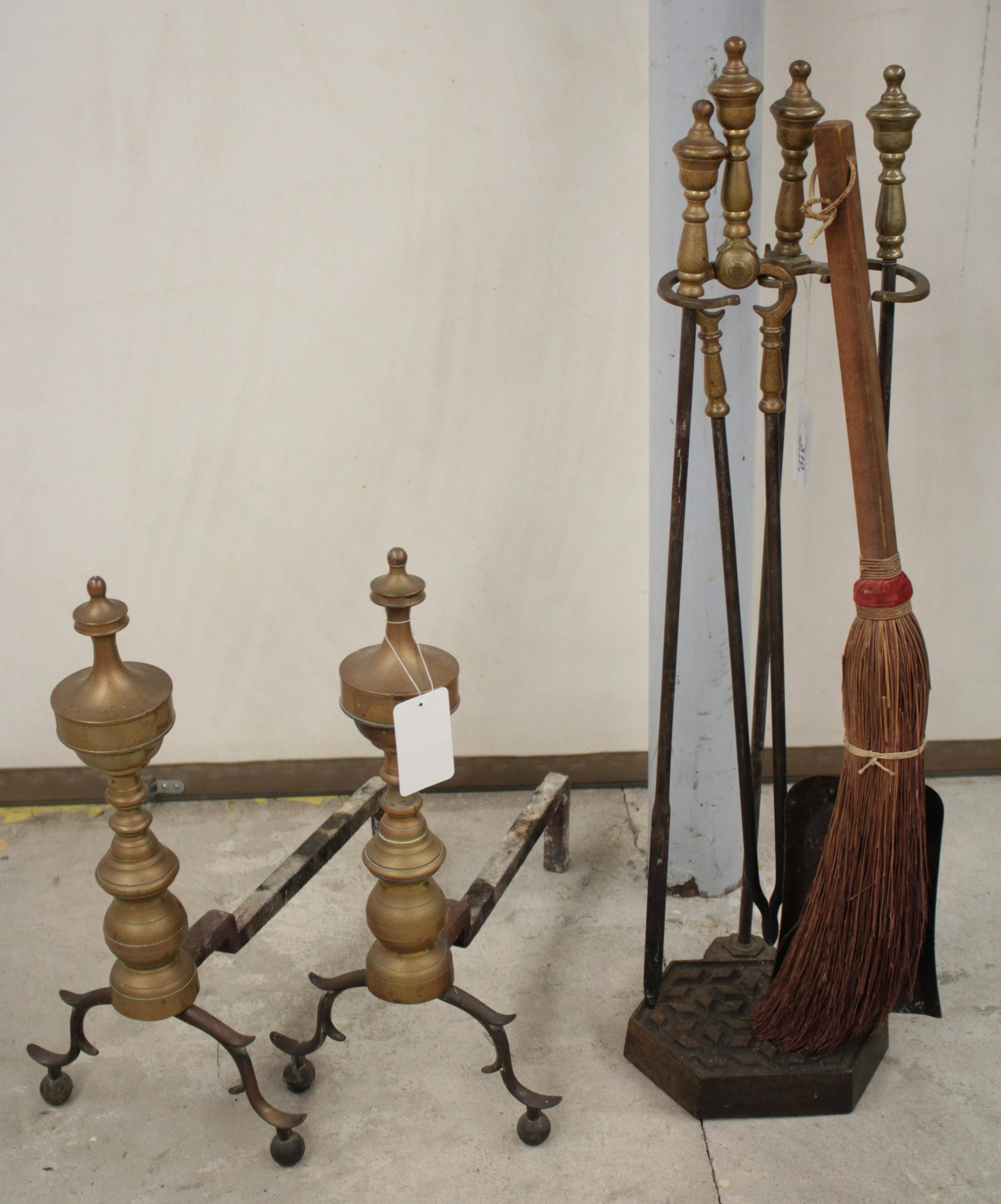 19 C. Brass Urn Topped Andirons; Hearth Tools: Cabriole, spurred legs. Tools: tongs, poker, shovel, hearth broom, iron honeycomb base stand. andirons 19"H x 17D BBRA9310/7 JP