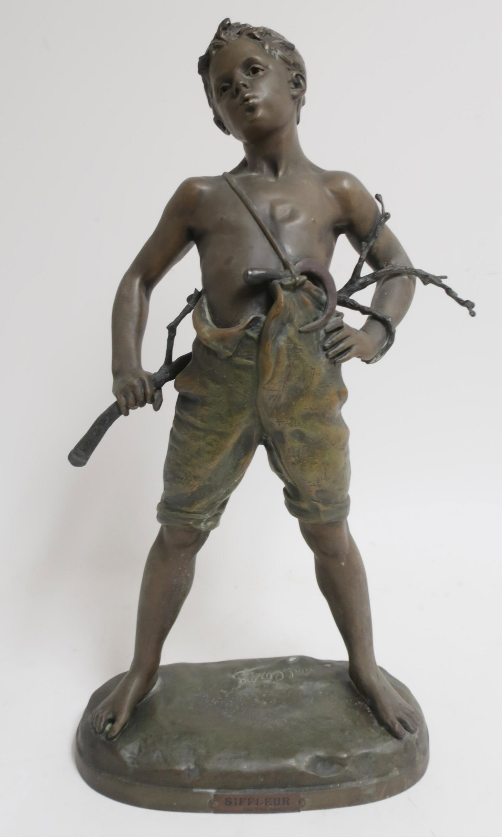 After Charles Vital-Cornu French 1851-1927: "Siffleur" (whistler) boy with sickle and branch, patinated white metal, bears signature. 26"H x 14"W x 7"D inches QDRIC570 WT