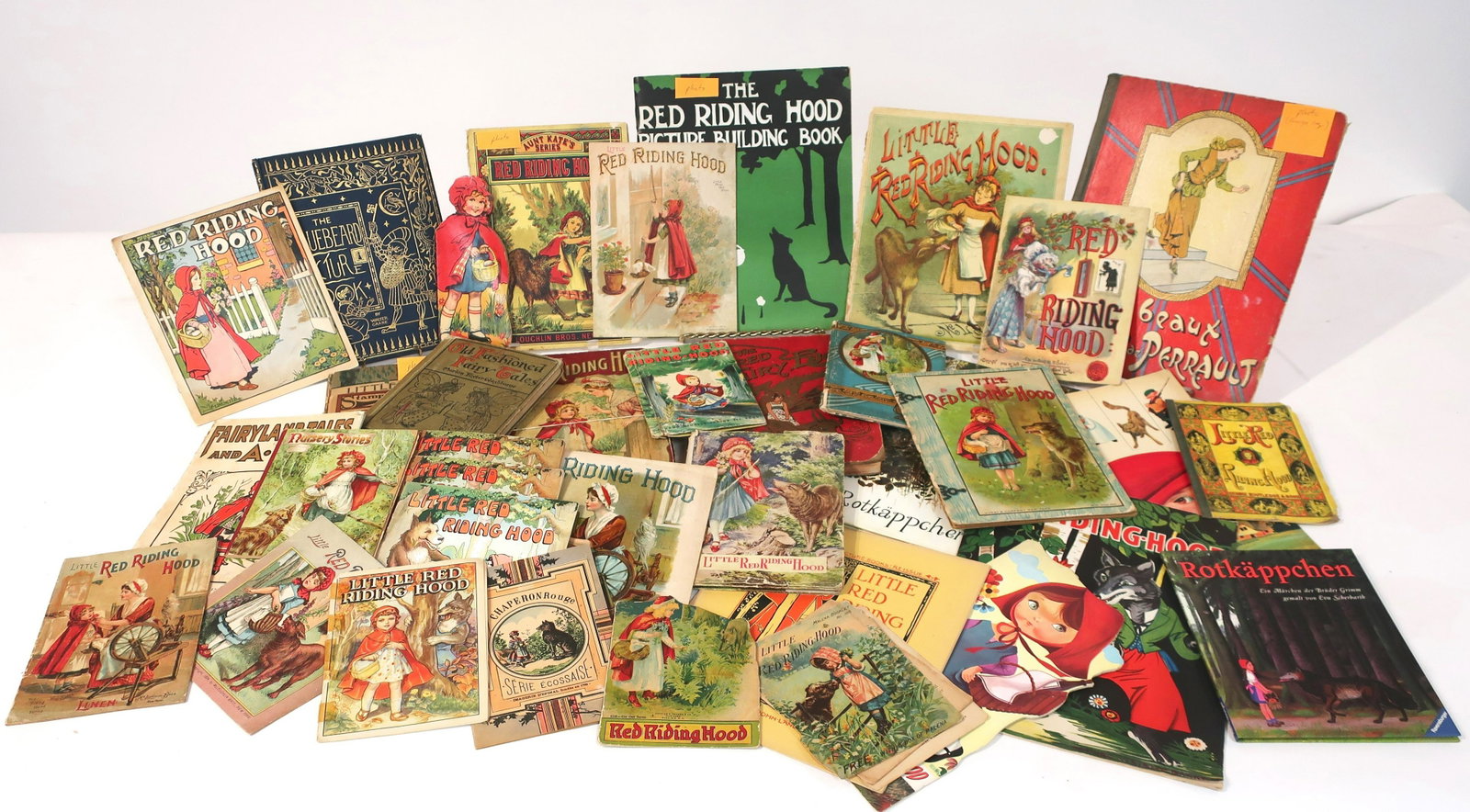 Little Red Riding Hood Vintage Storybooks: Paper and hardcover. Many small/"palm" size format. US,French,German versions. Publishers and illustrators: Sully; Julia Daniels c. 1920; Stampkraft c.1915; McLoughlin Bros. c.1888; Platt & Peck Co.; 