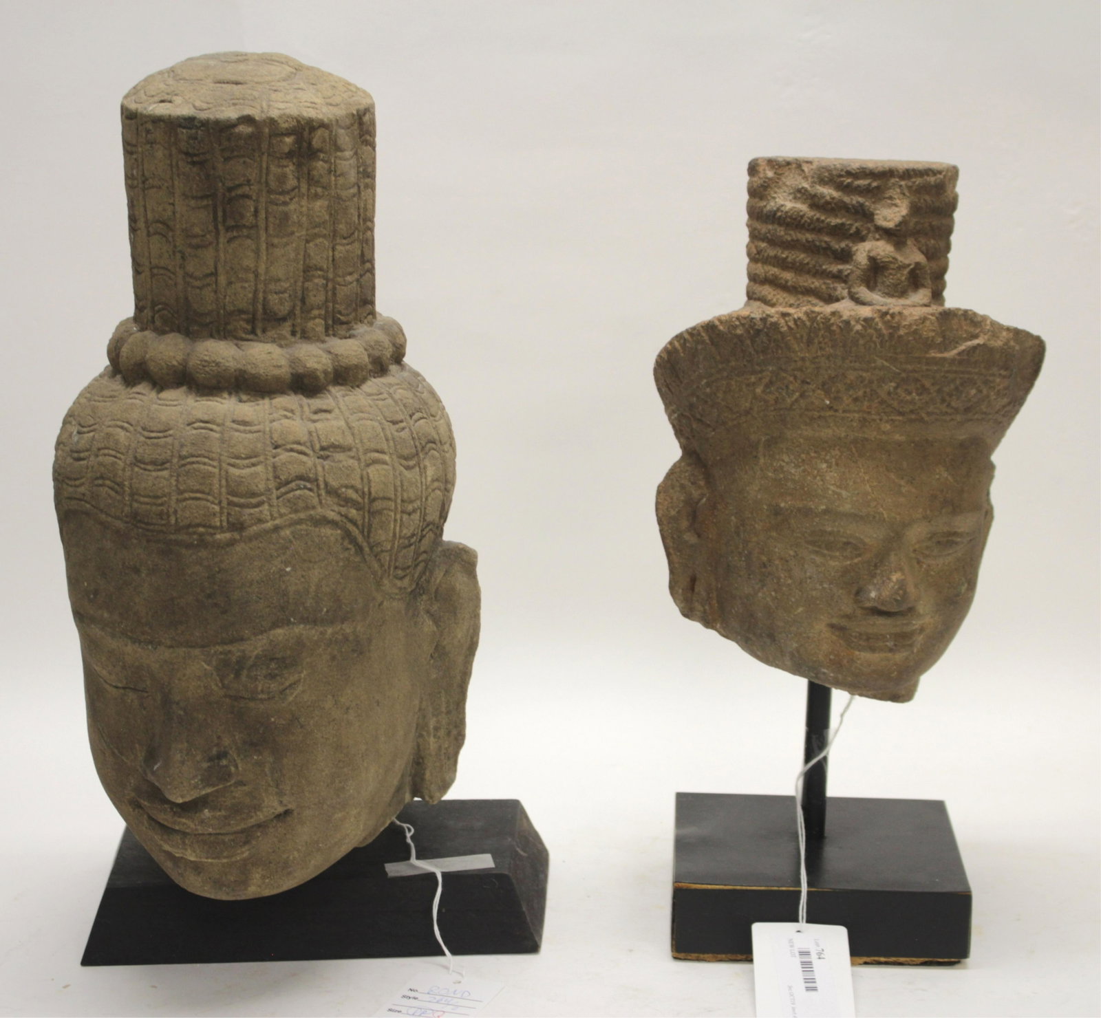Two Khmer 12th/13th Century Fragments: Two carved stone Buddha heads typical of the Cambodian style of the period. Very well carved 15" and 9 1/2" Property from a private collection - East 66th at Madison Ave, Manhattan (ROND764)(PR)