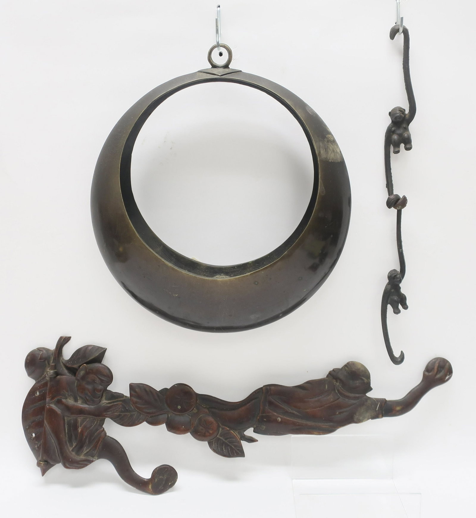 Japanese Bronze Hooks & Other: Coat hook in the form of two monkeys, 2 small monkey hooks, moon shaped handing candle holder. 7 x 22, 12" diam x 8" H Property from a private collection - East 66th at Madison Ave, Manhattan (ROND106
