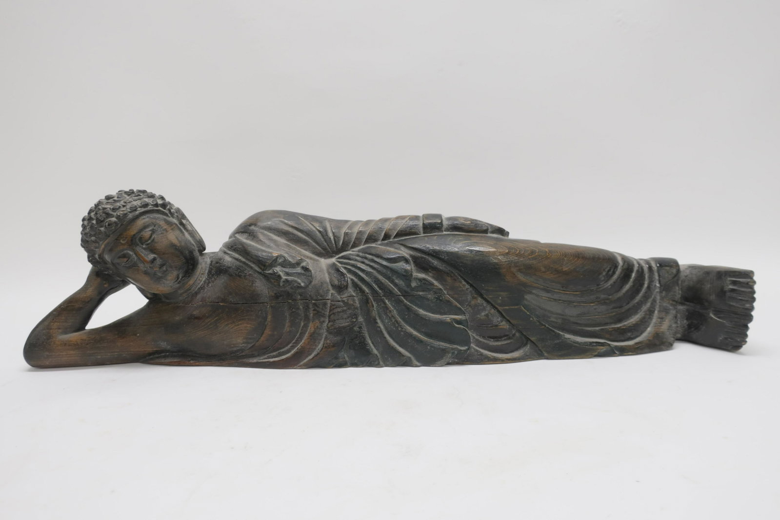 Asian Reclining Carved Wood Buddha: 6 H x 23 L Property from a private collection - East 66th at Madison Ave, Manhattan (ROND1037)(WT)
