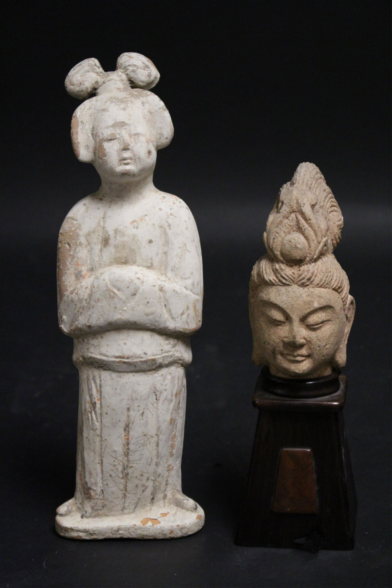 Tang Guanyin Head and Lady: Small stone head with wood stand. Offered with a Mid-Tang style terracotta figure of a lady simply modeled with folded arms and an overall white slip/pigment. 5" high without stand and 11 1/2" high Li