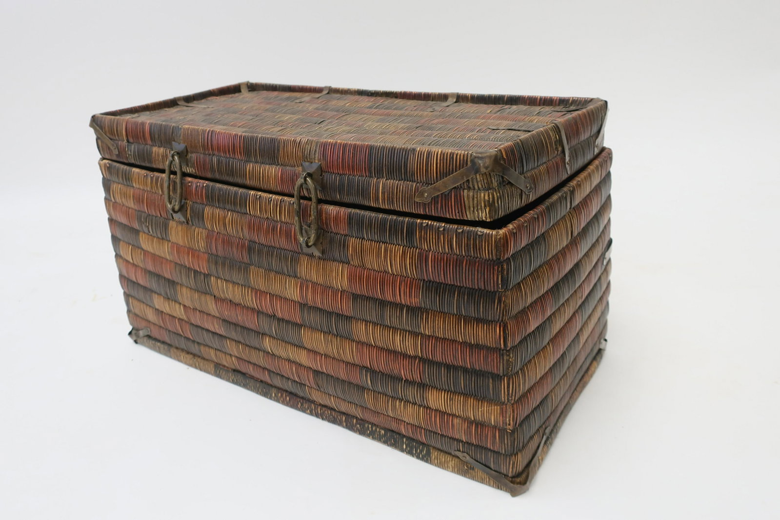 Asian Woven Rectangular Box: Multicolors with brass mounts 11 H x 21 L x 9.5 Litchfield Auctions is honored to offer Selections from the Collection of Peter Tillou. Peter has enjoyed wide renown across the United States and Inter