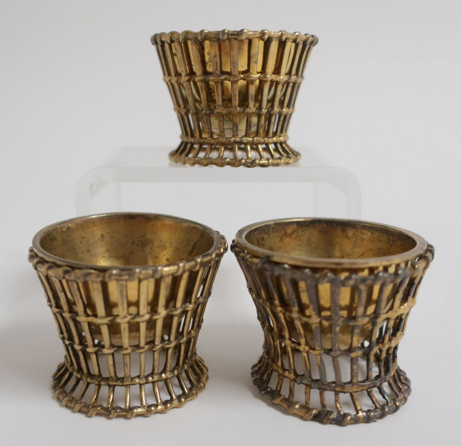 Set of 3 Silver Gilt Open Salts or Egg Cups: Basket like holders 1.5 H x 1.75 diam Litchfield Auctions is honored to offer Selections from the Collection of Peter Tillou. Peter has enjoyed wide renown across the United States and Internationally