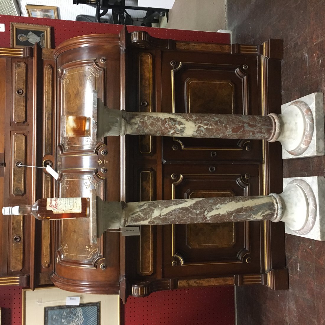Pair of Marble Pedestals in Mottled Grays and Rouges: a pair of unusual Neoclassical columns/pedestals, mottled grays and rouge marbles, square tops with canted corners atop Corinthian carved capital, elements do not detach, petite dimensions 36" H, top 