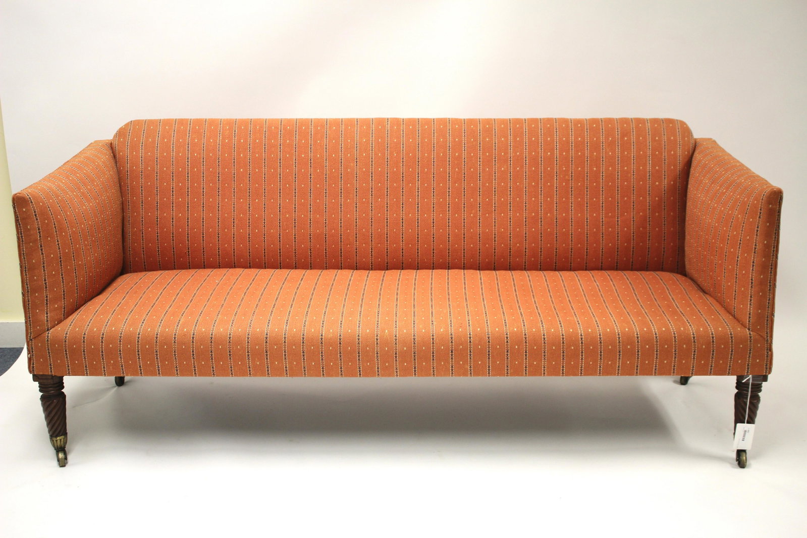 Federal Mahogany Settee, c 1810: Upholstered in pattern cast cotton 30.25 H x 71 W x 25.75 D Litchfield Auctions is honored to offer Selections from the Collection of Peter Tillou. Peter has enjoyed wide renown across the United Stat