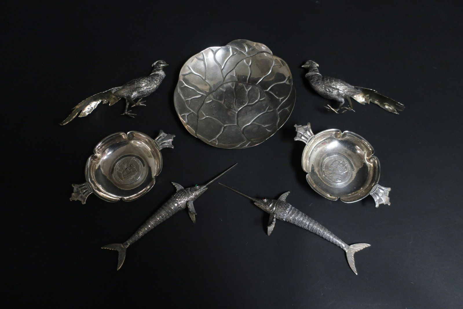 Seven Silver Pieces, Tiffany & others: Tiffany dish, pair English small dishes by R.E. Stone, pair .835 silver gilt pheasants, and pair Spanish .800 silver reticulated sword fish. 18.21 OZT. Tiffany: 6 DIAM Sword: 7 L (QLIV317/7)(WT)