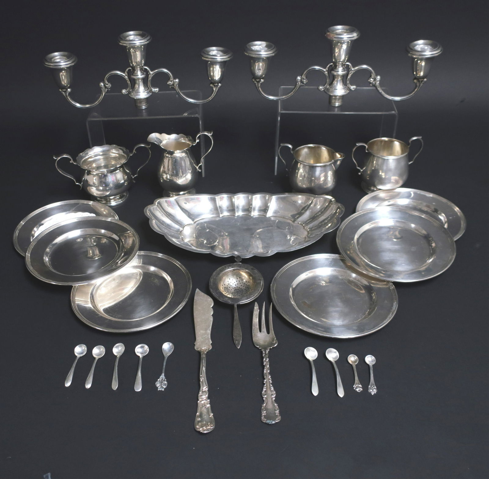 Sterling Silver: Cartier Plates Sugars Creamers: mixed Sterling: 6 Cartier Lord Saybrook dishes, two sets sugars and creamers, scalloped tray, tea strainer, fork and knive, misc. salt spoons, and a pair of weighted three socket Gorham candelabra top