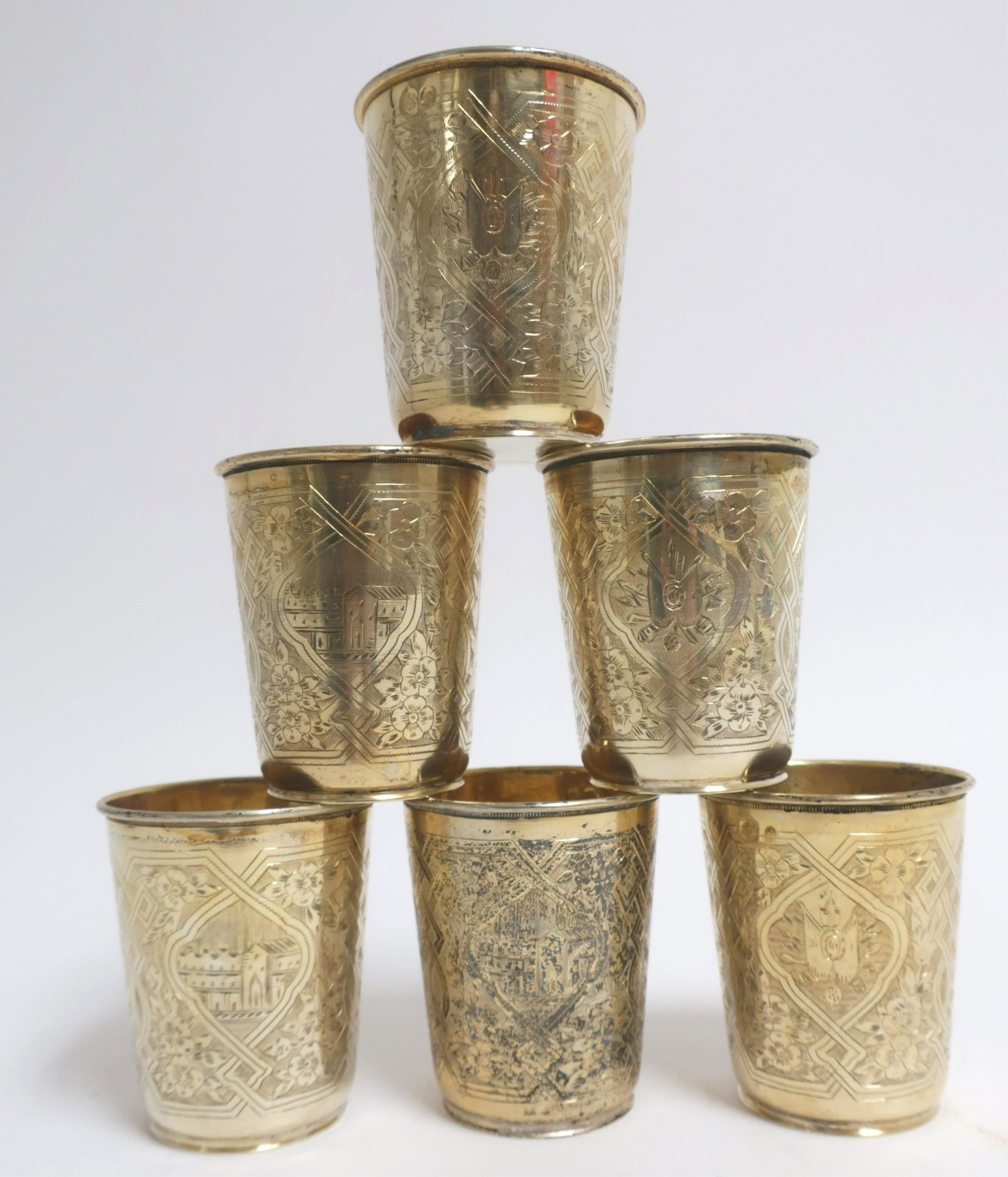 Set of 6 Turkish Silver Gilt Beakers: Incised geometric and architecture decoration. 11.75 ozt, 3.25 H x 2.75 diam Property from a private collection - East 66th at Madison Ave, Manhattan (ROND582)(WT)