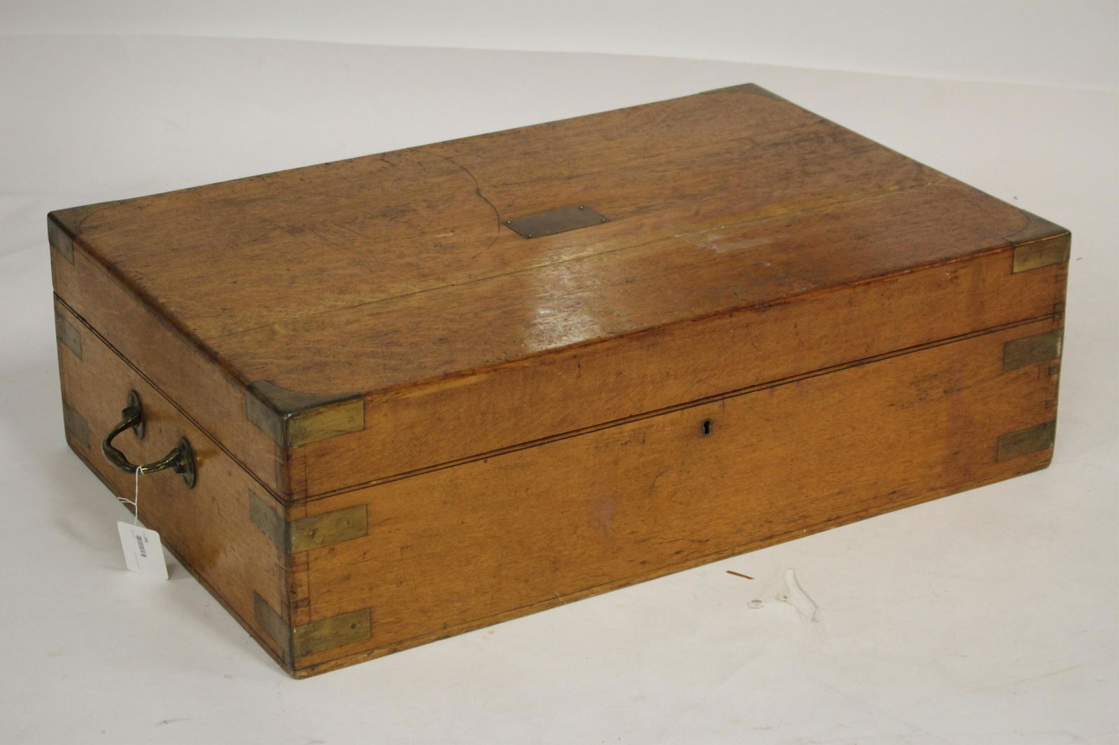 Large Antique Mappin & Webb Oak and Brass Case: brass corners and handles, key and lock, brass tag, with a blue velvet flocked fitted interior, c. 1900 35" W 23" D x 11" H (TSMI558)(TC)