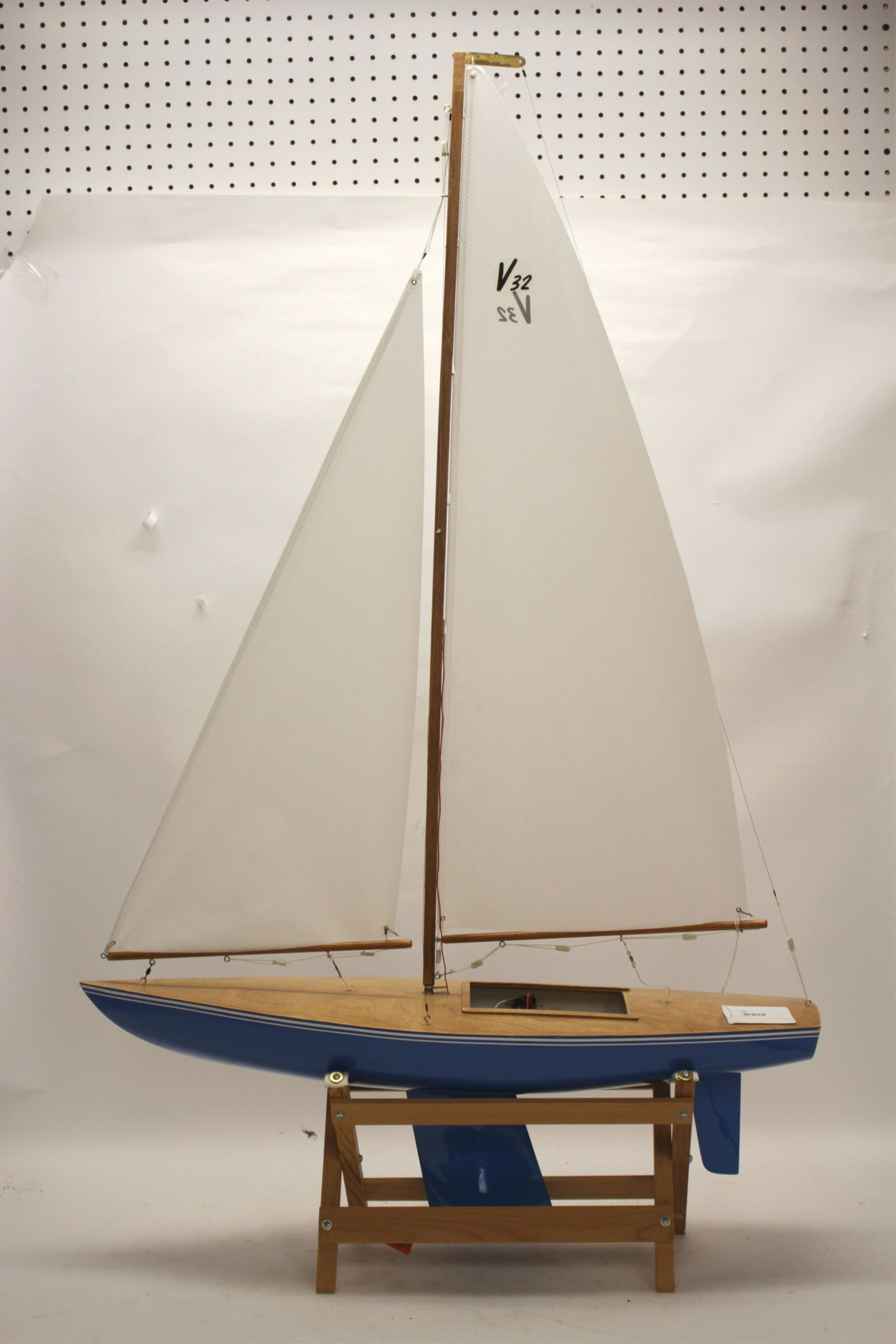RTR Pond Sailboat V-32 Hull by Victor Model: Painted and striped wood hull, clear finish top deck; synthetic cloth sails; wire and cord rigging. V-32 hull #2791, Victor Model Products, Downey, CA. HiTec Challenger 250 remote radio controlled. Ne