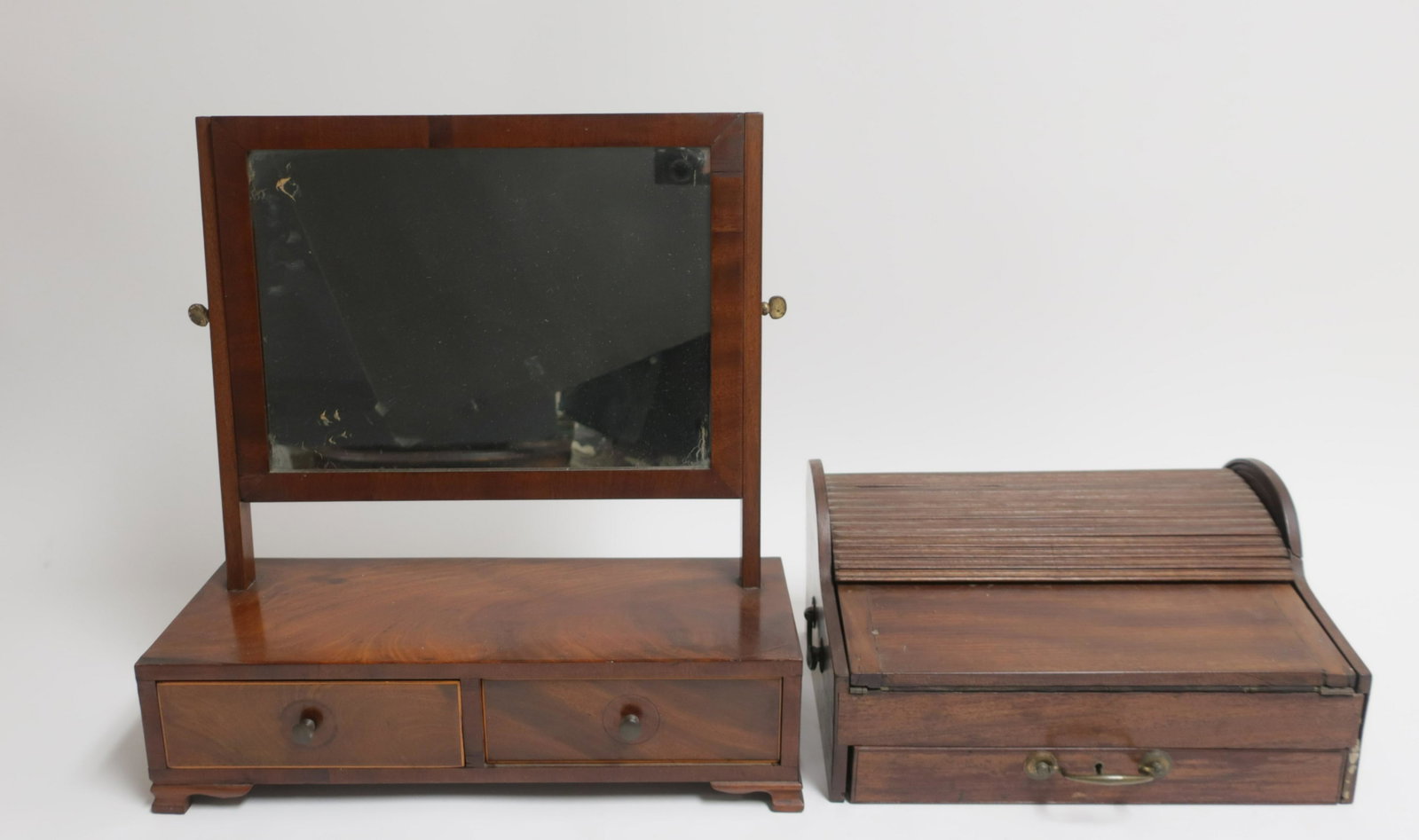 19th C. Campaign Lap Desk, Gentleman's Mirror: Mahogany Tambour top Campaign Lap Desk and Gentleman's Mirror, 19th C., interior fitted with compartments Desk 7 1/2"H x 15"W x 11"D, Mirror with stand 19 1/2"H x 18 1/2"W x 8"D (RCJL10388/2)(MM)