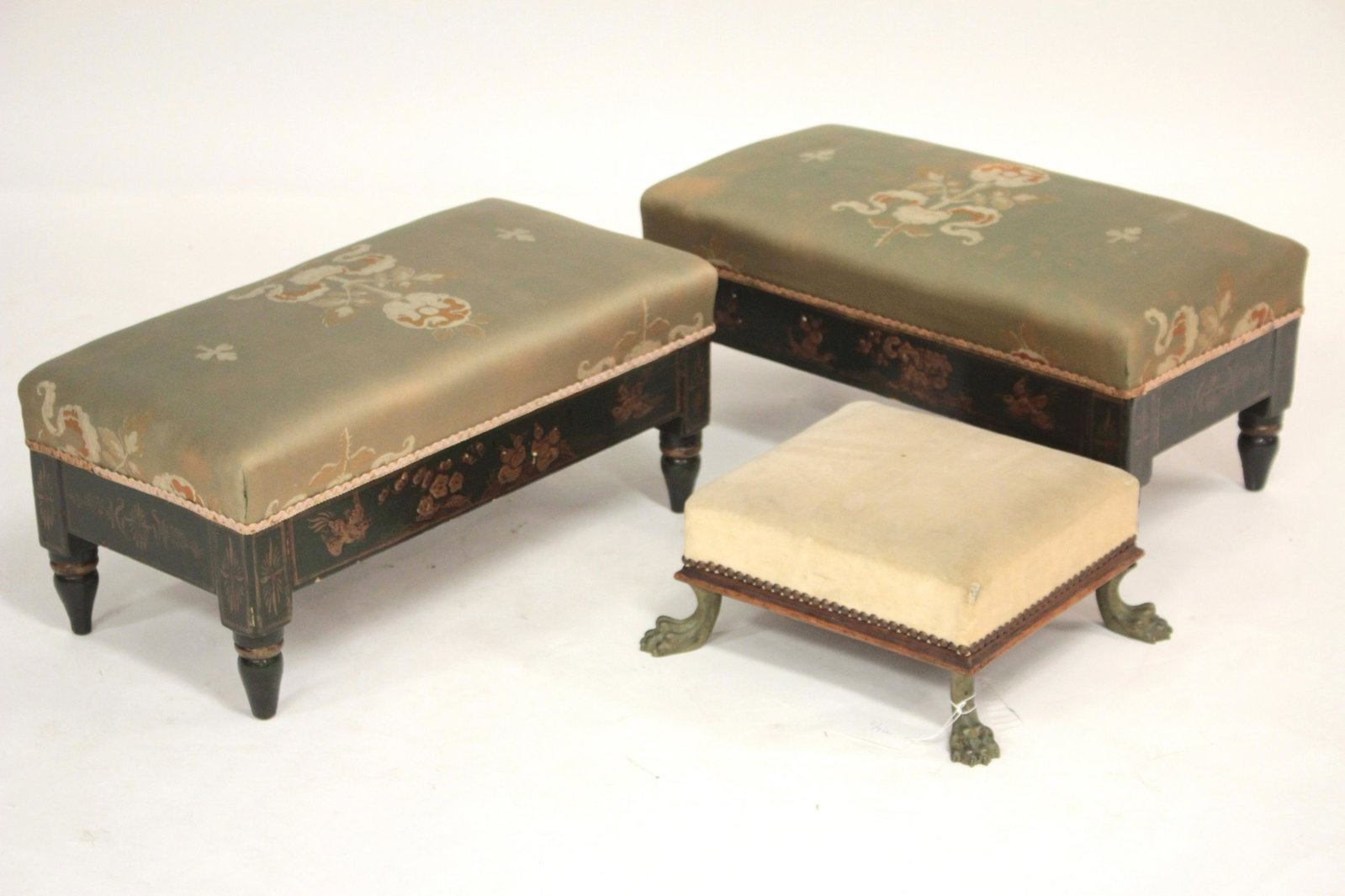 Pair of Low Benches and a Foot Stool: Pair of green lacquered and japanned with Chinoiserie low benches, probably English mid 19th C. together with a square foot stool with gilt bronze paw feet. 10.5 H x 24.5 L x 12.5 D & 6 H x 13 Sq (QSH