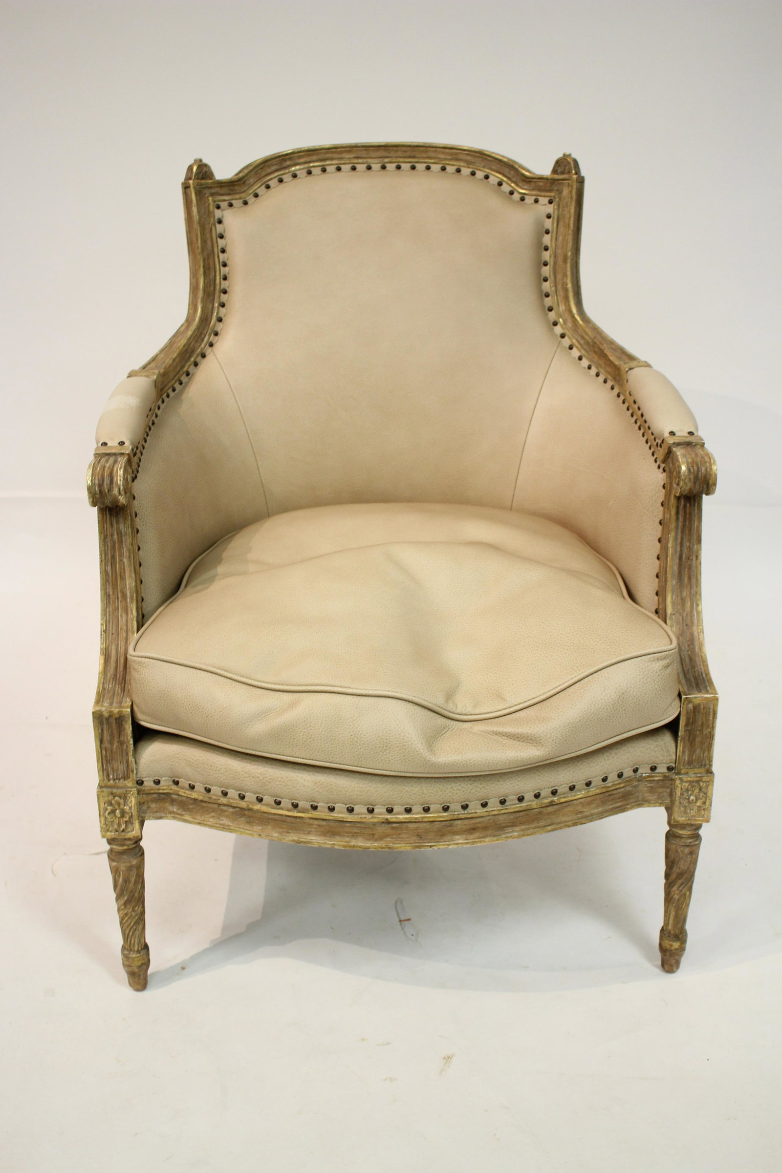 Louis XVI Style Giltwood Bergere: Tan leather upholstery 37.75 H x 28.5 W x 31.5 D Property from the collection of Martha Rogers & Dick Cavett (MROG928)(MS)