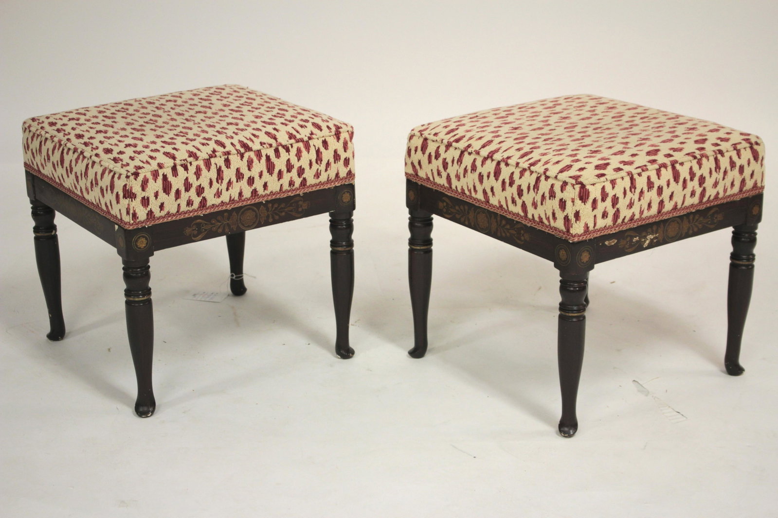 Pair Faux Grain painted & Gilt Decorated Benches: Low benches with a red and white machine needle work upholstery. 15 H x 15 Sq (QSHER417/2)(WT)