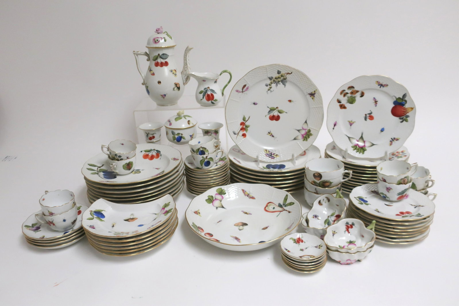 Herend Porcelain Partial Dinner Service: Autumn fruit, vegetables comprises 8 Dinner Plates (10") 8 Soup Plates (9.5") 8 Bread/Butter Plates (6.5 ") 12 Lunch/Salad Plates (8") 6 Crescent Shaped Side Plates (7.5") 6 Butter Plates (3.5) 3 Tea 