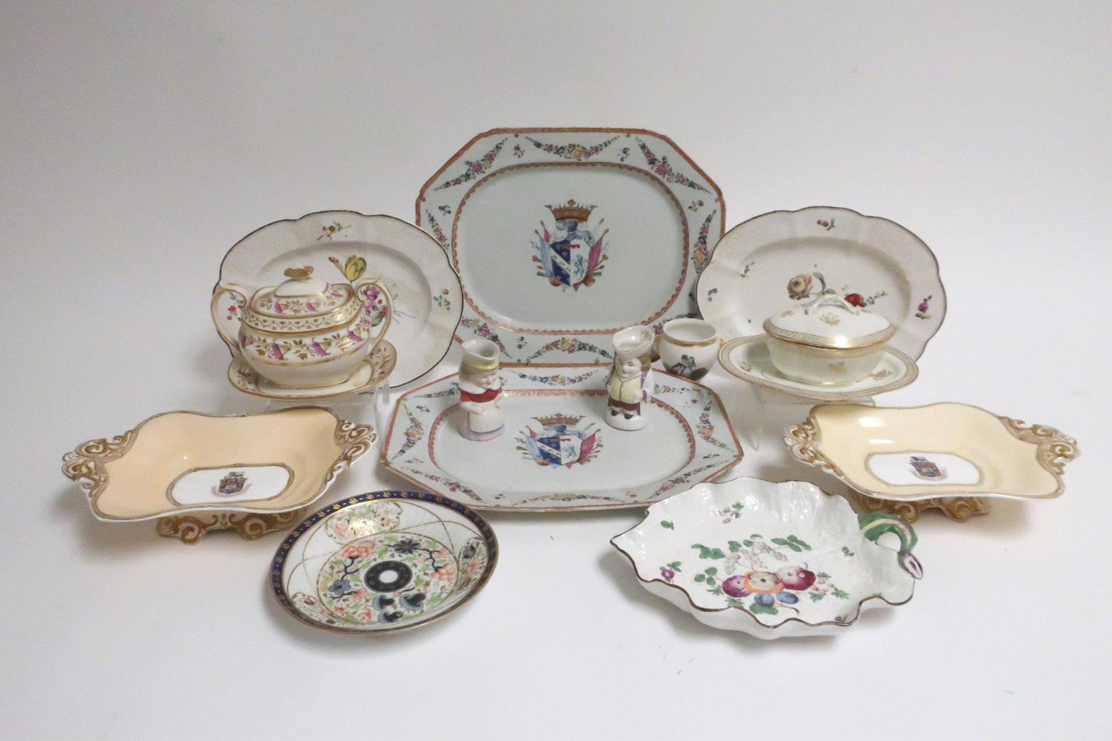 Collection Antique Porcelains 18th & 19th C.: Includes pair of large Chinese export armorial platters, Pair of Hochst Platters, Pair of Copeland and Garrett footed armorial serving dishes, Samson leaf dish and other English porcelain (13 pcs) Lar
