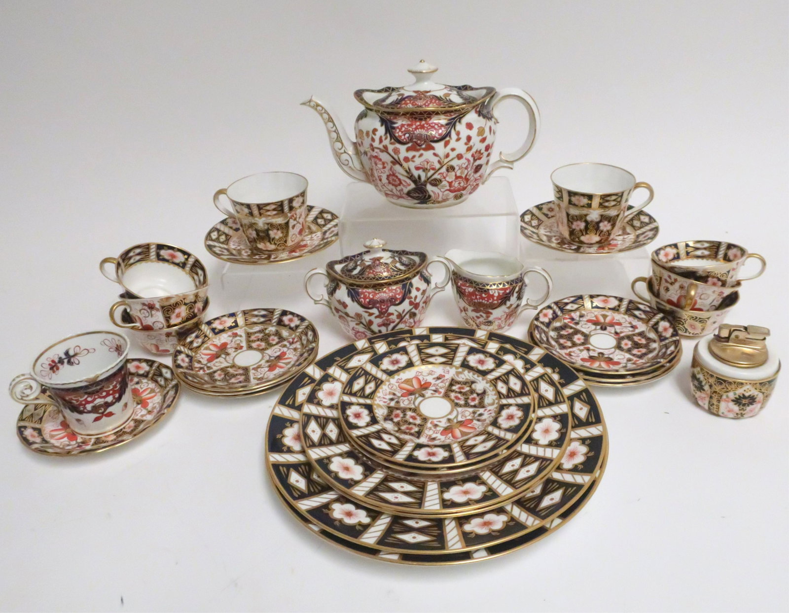Royal Crown Derby Assembled Porcelains: Imari Pattern comprises of service for 2 2 Dinner Plates (10.5 Diameter) 2 Lunch Plates (8.5 Diameter) 2 Bread/Butter Plates (6") 2 Cups and Saucers Together with 3 piece tea set in variant patterns 6