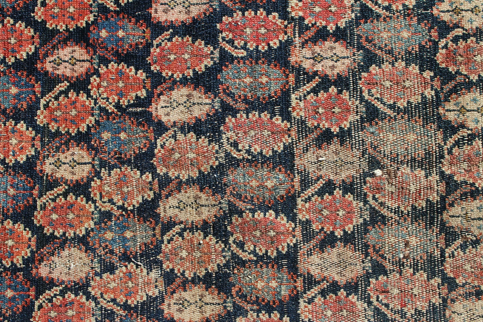 Persian Hand Knotted Wool Rug 5'-10" x 12'-10": 19th C. Persian Hand Knotted Wool Hall Rug, dark blue field with rust cream and blue boteh, border with complimentary floral motifs 5'-10" x 12'-10" (BBRA10820)(MM)