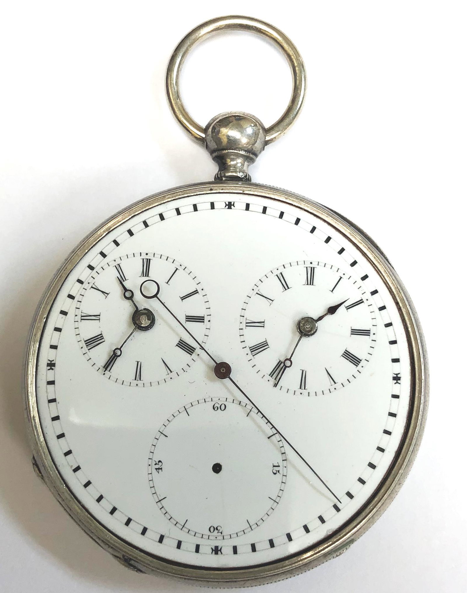 M. I. TOBIAS & CO - Silver Pocket Watch: Open face dog and flowers engraved engine turned silver case, traveler’s dual time zone watch, white enamel dial with black Roman numerals and seconds subsidiary dial, center-seconds hand, case inte