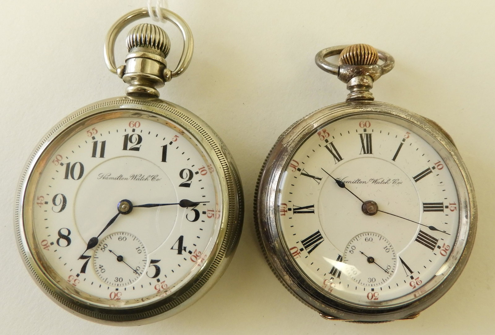 Two Hamilton Watch Co. Pocket Watches: HAMILTON NICKEL GENT’S POCKET WATCH Open face nickel case, circa 1903, recessed white enamel stamped “Hamilton Watch Co”, black Arabic numerals with red outer track, seconds subsidiary dial, cas