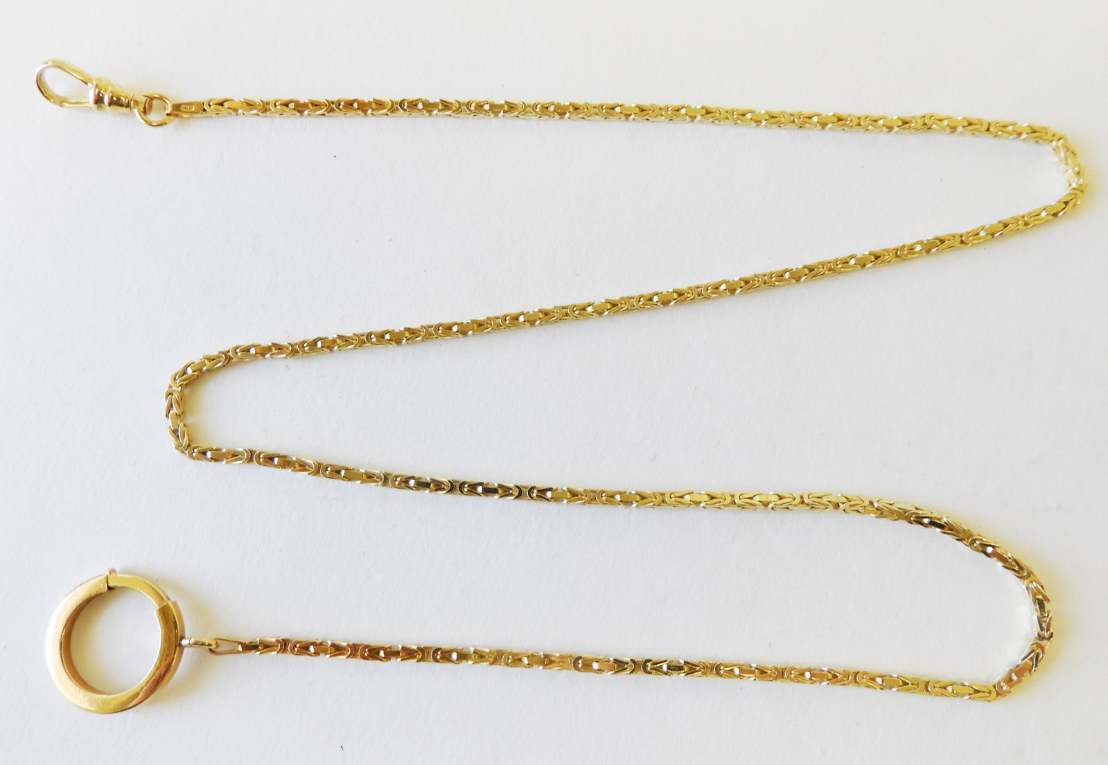 Byzantine 14K Gold Watch Chain: Byzantine link yellow gold watch chain with swivel clasp and oversize spring ring, stamped “14K” 16.9 grams. 20" long Property from a Chevy Chase, MD Estate. (LEE1000)(EL)