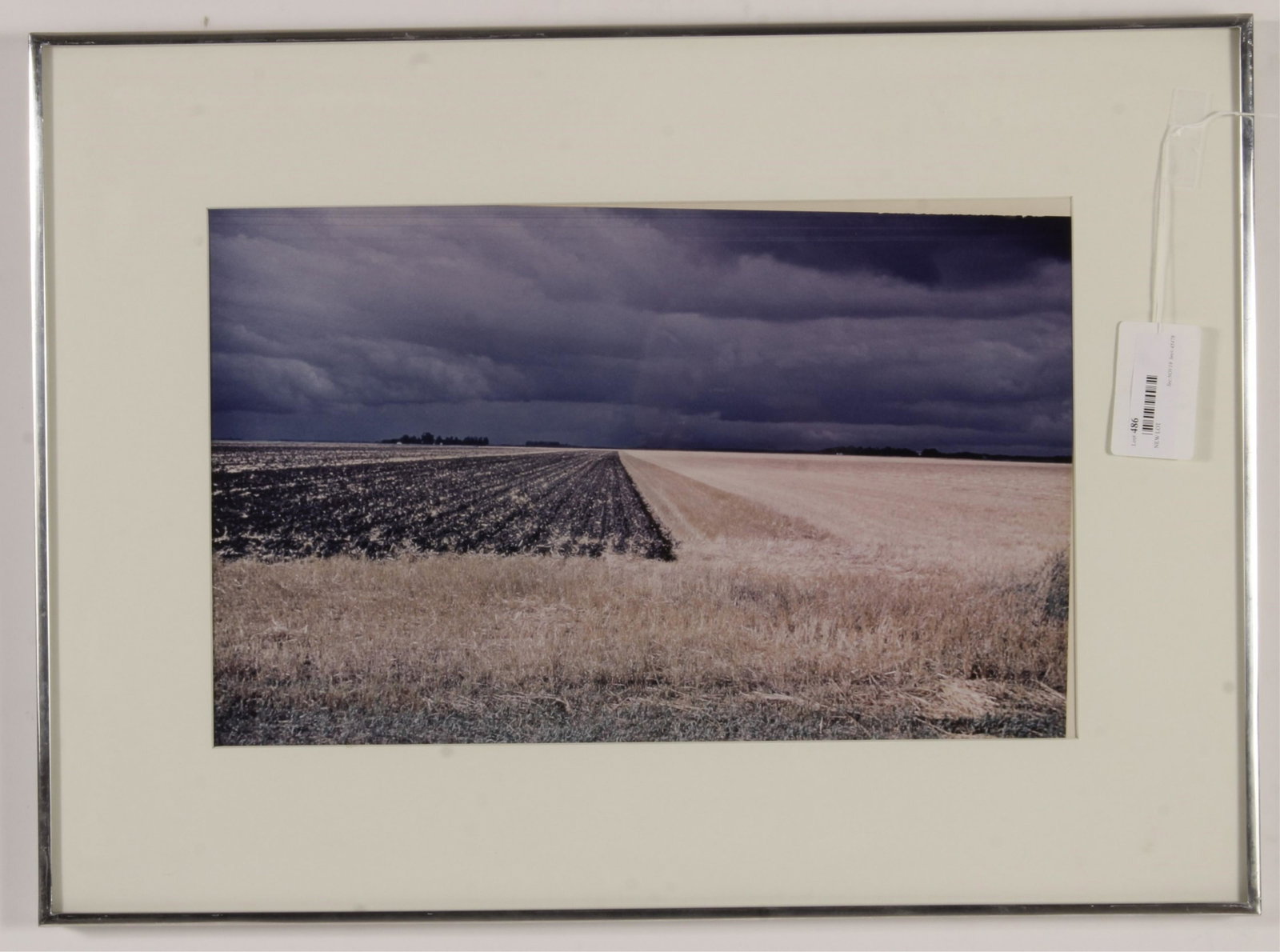 Photograph of Field Before Storm: Artist unknown. Unsigned and undated. Silver metal frame. Not examined out of frame. 11.5 x 18.5 Framed: 19.25 x 26.5 Property from the Milbank Collection. (MTHM486)(EL)