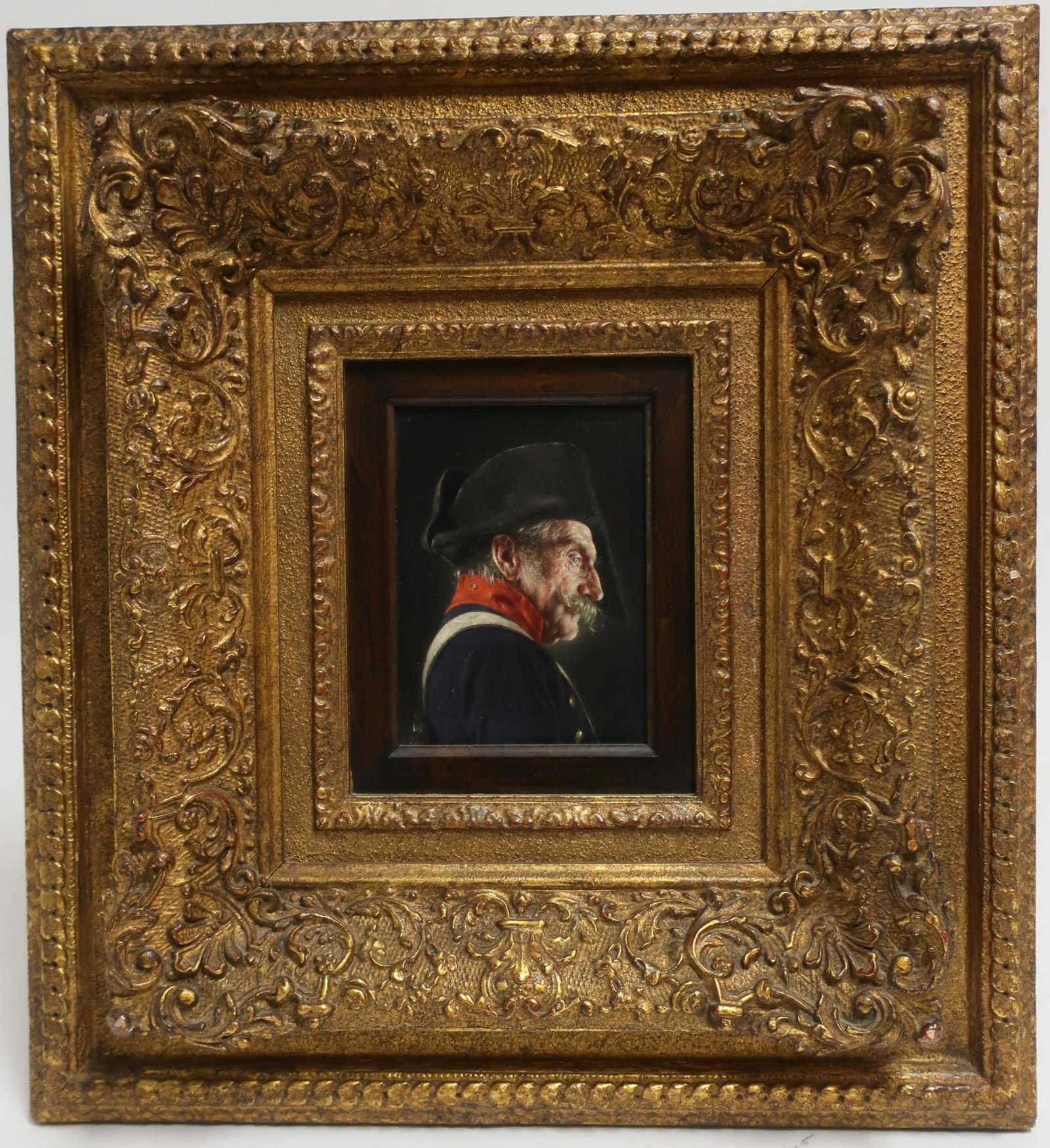 Carl Kronberger - Profile of an Officer, O/B: Carl Kronberger (1841-1921, Austrian), Older officer, uniformed , bicorne hat. Signed upper right. Antiqued dark gold frame on frame with dark stained wood sight liner. 5.25 x 3.75 Framed 16.75 x 15.5