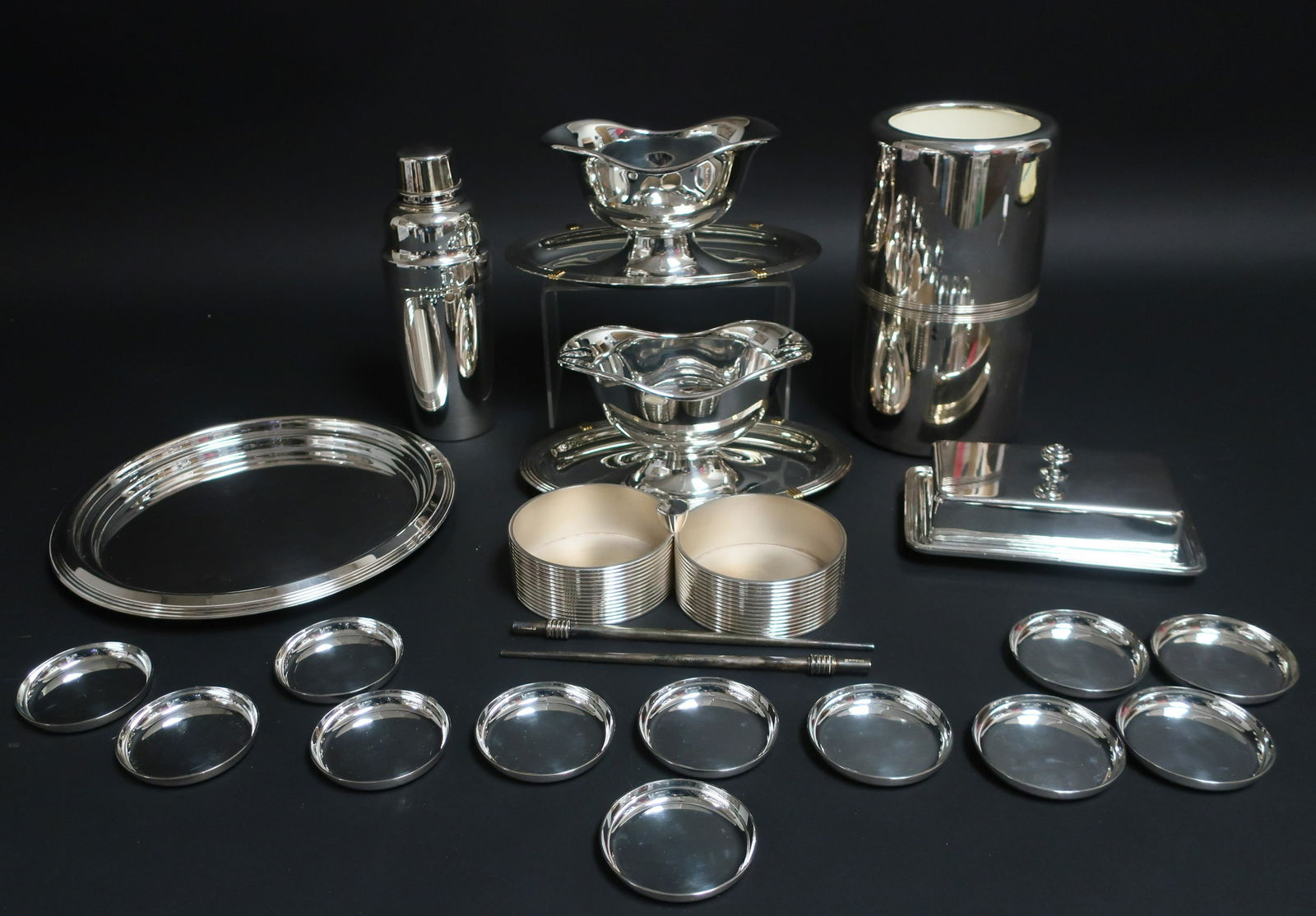 21-Pc. Modern Silverplate, Christofle, Puiforcat: Group of Modern Silverplate, 20 pieces of Christofle and one Puiforcat covered butter dish (21 pc.) Butter 6 3/4" L x 4 1/4" W, sauce oats 4 1/2" H x 9" L, wine cooler 9" H x 5" Dia. Property from the